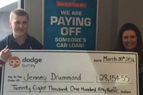 Photo of contest winner Jenney Drummond holding cheque